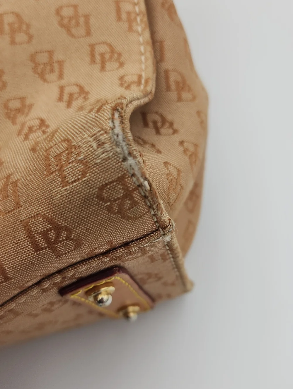 Dooney & Bourke Signature Monnogram Brown And Pink Satchel Bag‎